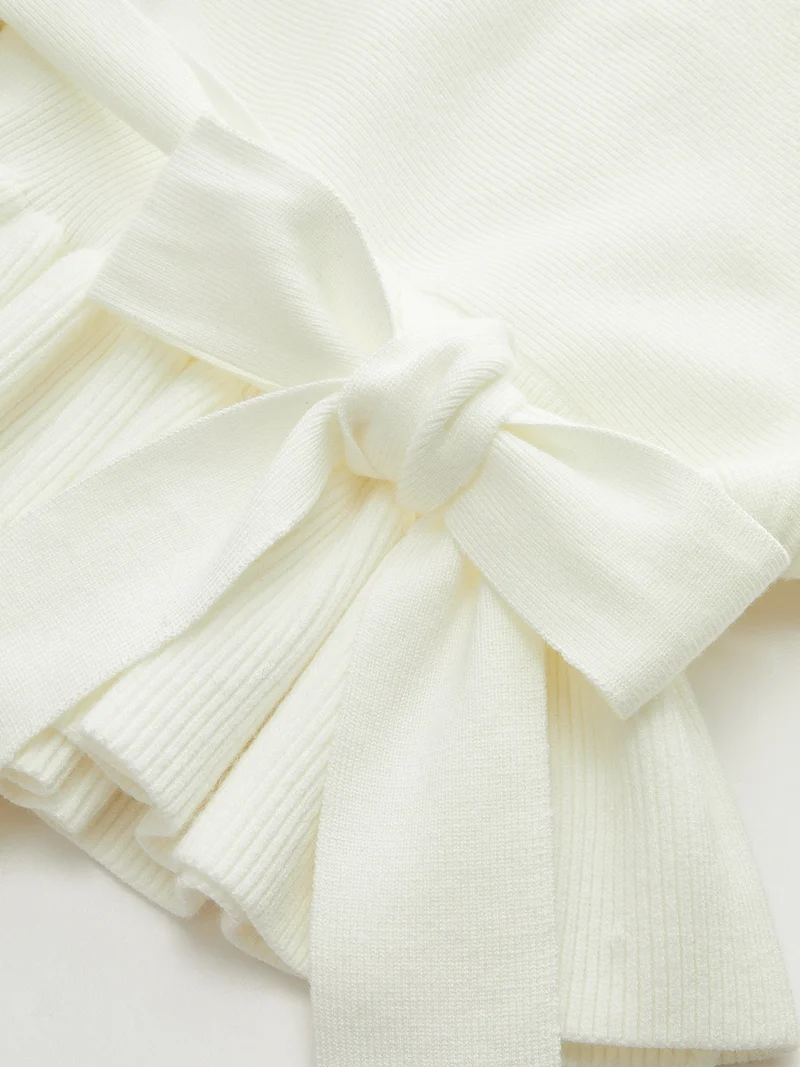 Enya – Strickoberteil mit Schleife und Schößchen