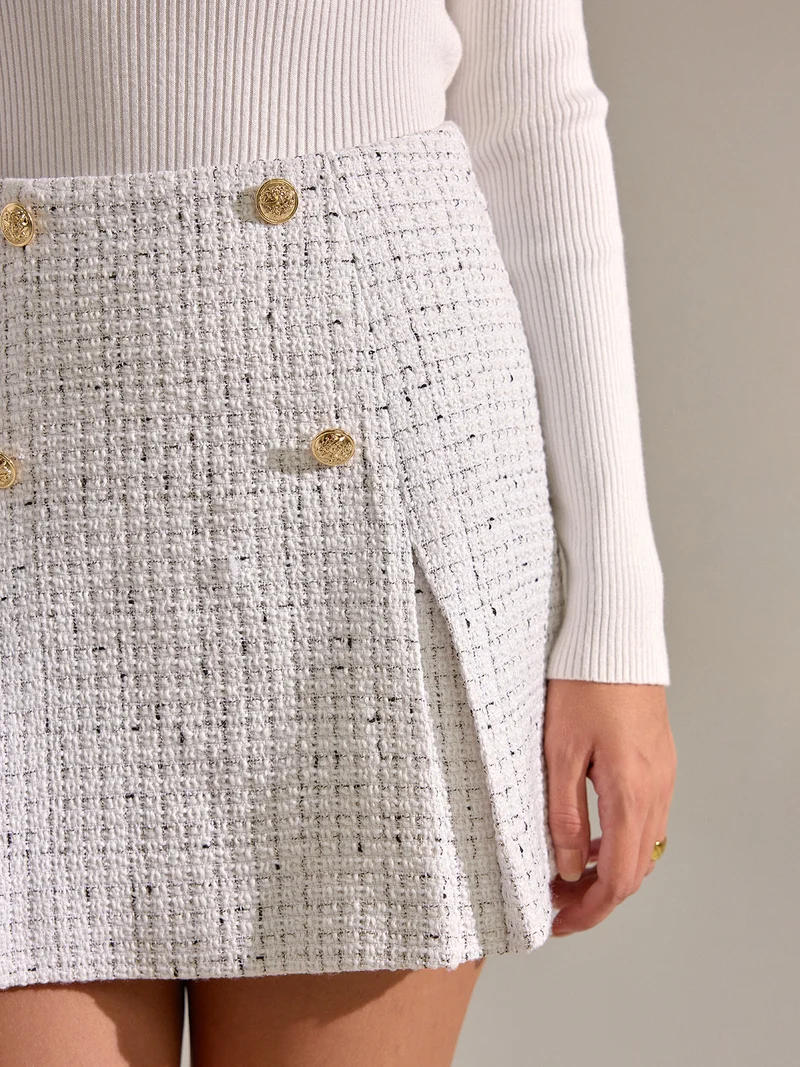 Hedwig - Minirock aus plissiertem Tweed mit Metallknöpfen