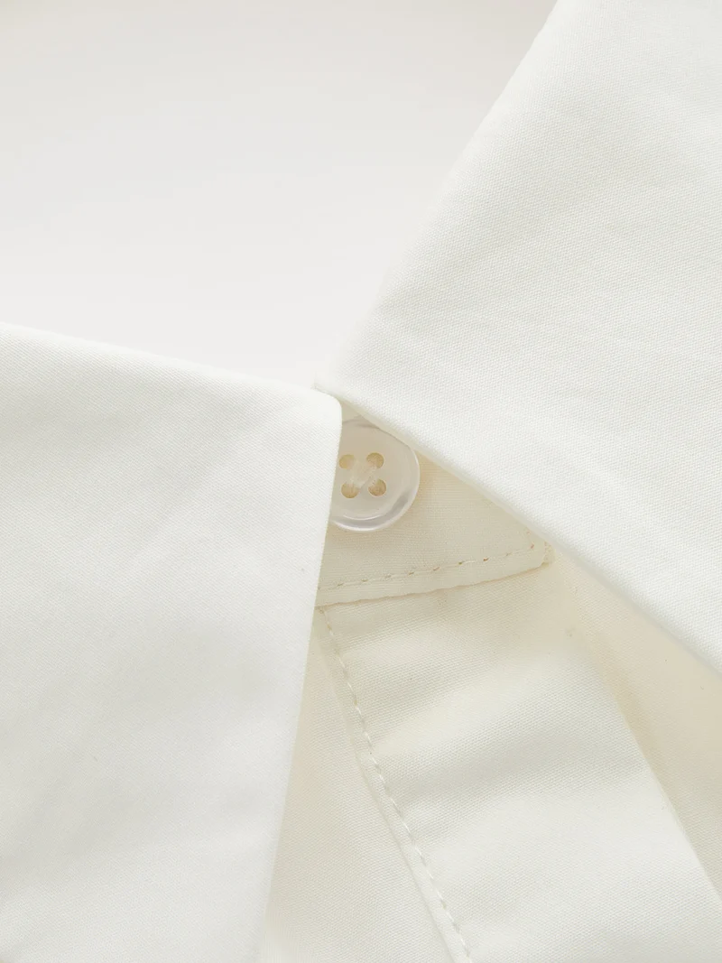 Meike – Baumwollbluse mit Neckholder und rückenfreiem Schößchen