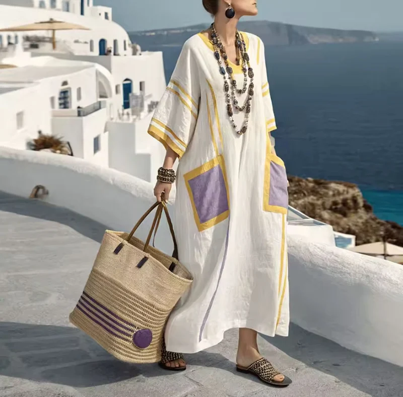 Mila-Kaftan-Kleid mit lavendelfarbenen Taschen und sonneninspirierten Akzenten