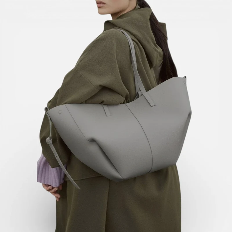 Große Damen Handtasche mit breiten Seiten und Schultergriffen