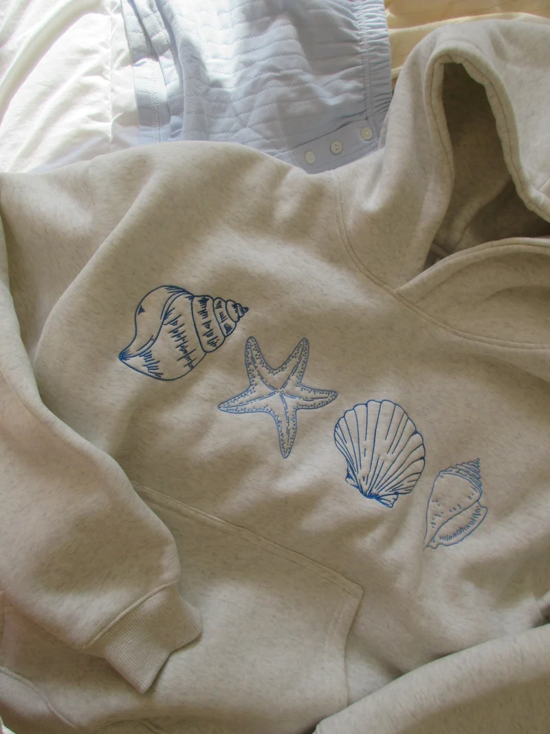 Ocenia | Unisex-Sweatshirt mit Muscheln