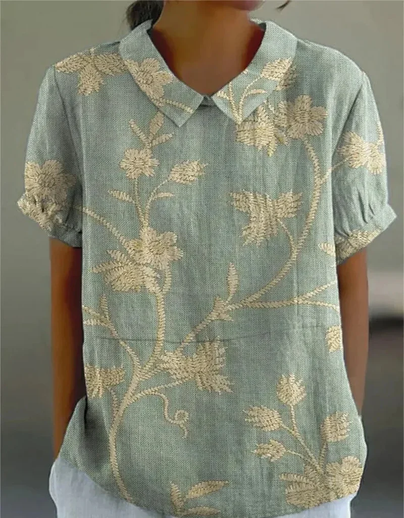 Damen Polo mit floralem Stickmuster und kurzen Ärmeln