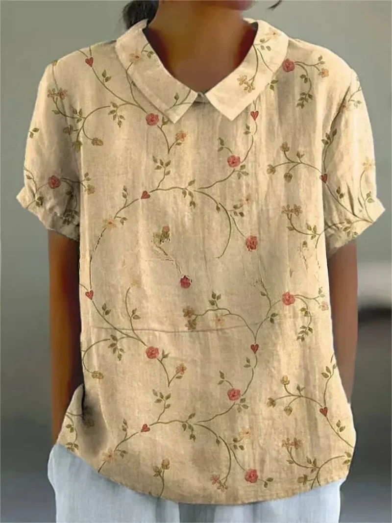 Damen Polo mit floralem Stickmuster und kurzen Ärmeln