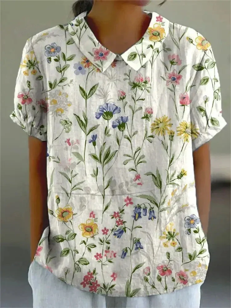 Damen Polo mit floralem Stickmuster und kurzen Ärmeln