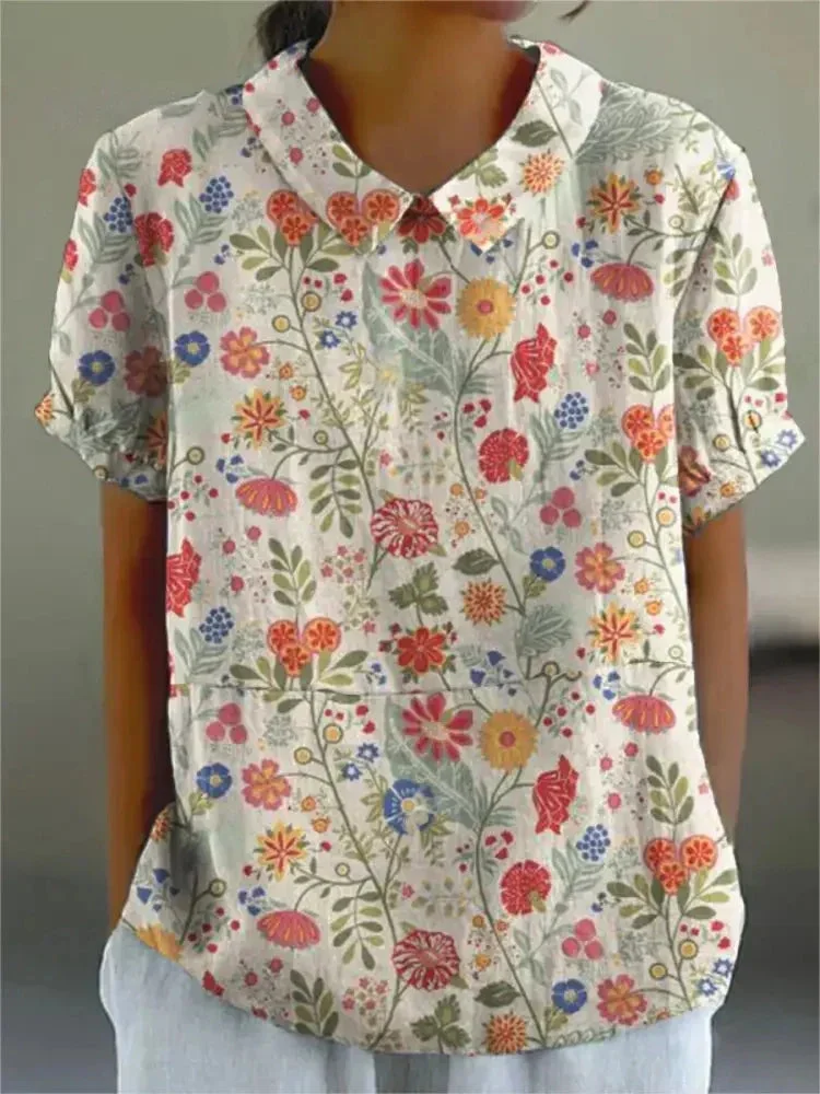 Damen Polo mit floralem Stickmuster und kurzen Ärmeln