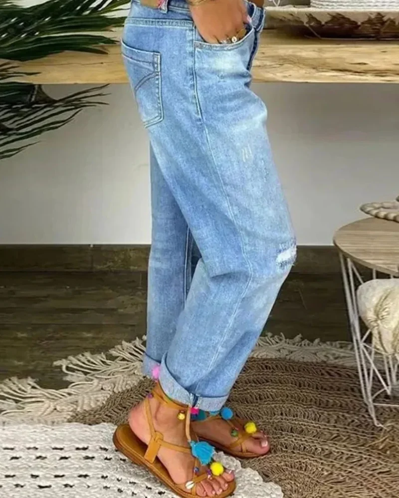 Damen Jeans mit Knopfleiste und Rissen in Blau