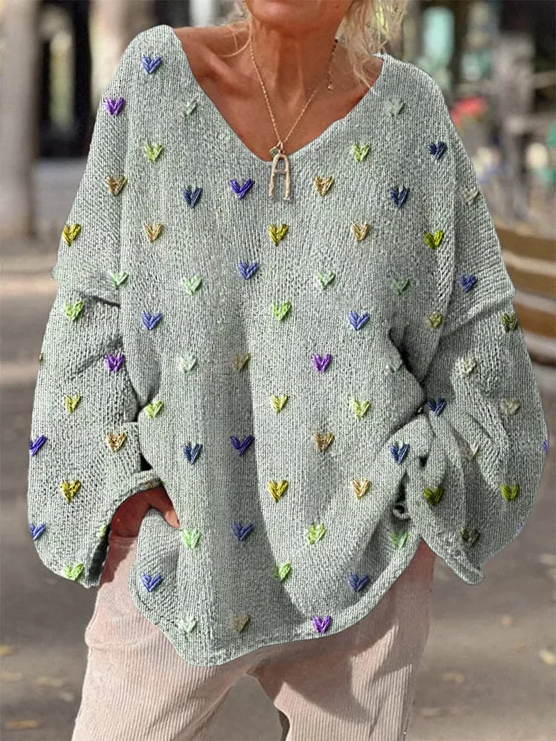 Damen Strickpullover mit bunten Herzmotiven und V-Ausschnitt