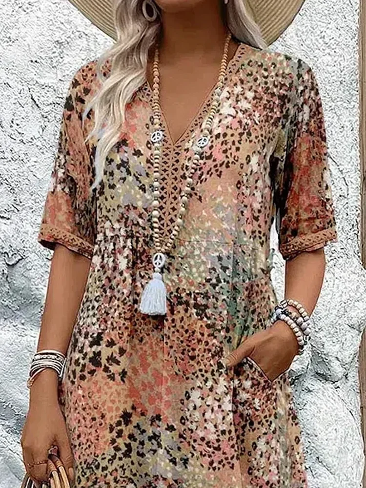 Damen Kleid mit V-Ausschnitt | Knie­länge und Musterdesign