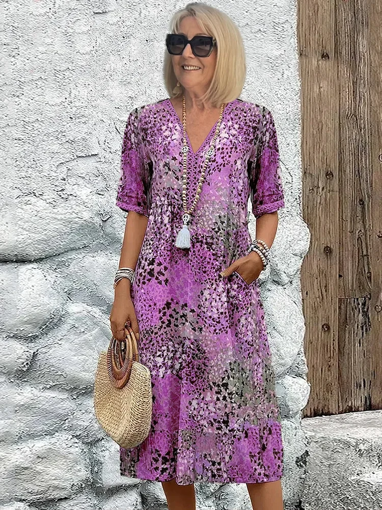 Damen Kleid mit V-Ausschnitt | Knie­länge und Musterdesign