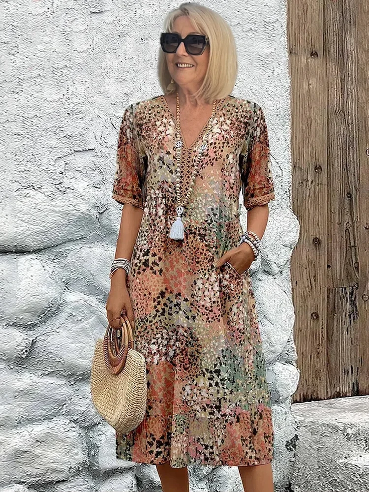 Damen Kleid mit V-Ausschnitt | Knie­länge und Musterdesign