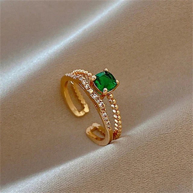 Verstellbarer Ring mit grünem Zirkon in Gold